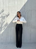 Oversize crne pantalone širokih zvonastih nogavica visokog struka sa kopčanjem na stranu