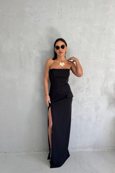 Uska duga crna top haljina sa dubokim šlicem sa strane i sa imitacijom džepova