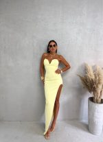 Puter pastelna žuta elegantna asimetrična korset haljina srcolikog dekoltea i dubokog šlica